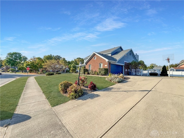 view of home's exterior with a garage and a yard