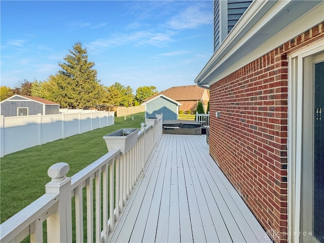 wooden terrace with a lawn