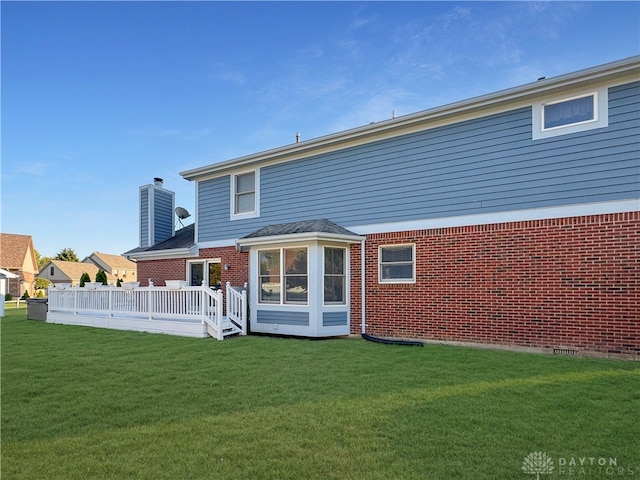 back of house featuring a yard