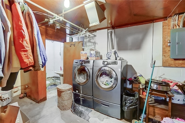 washroom with electric panel and independent washer and dryer