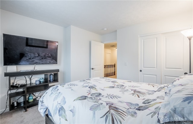 bedroom with carpet and a closet