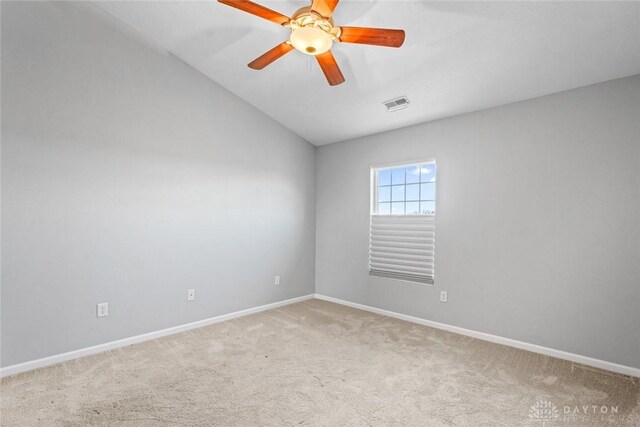 empty room featuring carpet flooring and ceiling fan