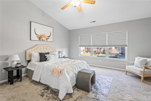 carpeted bedroom featuring ceiling fan and vaulted ceiling