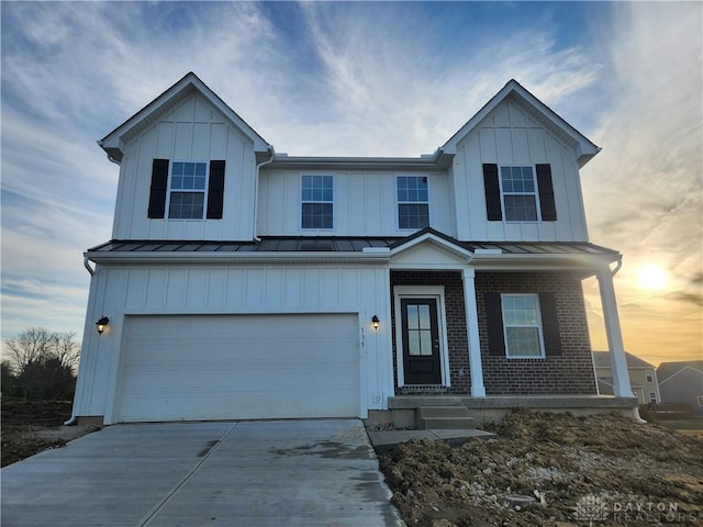 view of front of home with a garage and covered porch