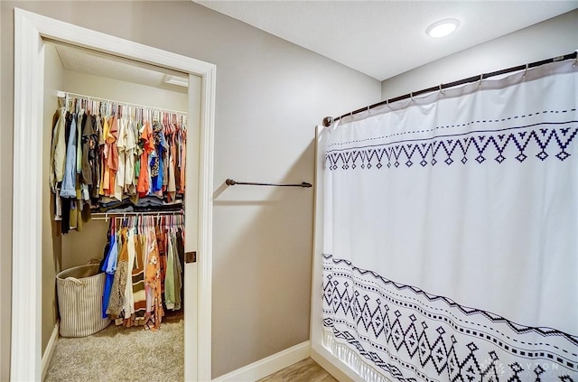 bathroom with a shower with shower curtain