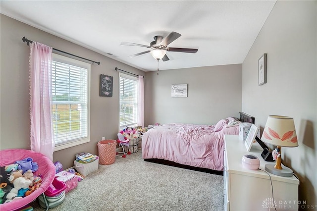 carpeted bedroom featuring ceiling fan