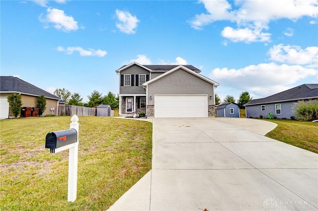 view of property with a garage and a front lawn