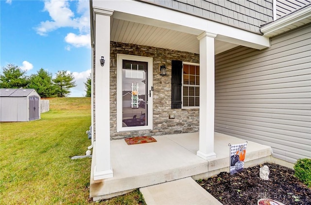 doorway to property featuring a porch and a yard