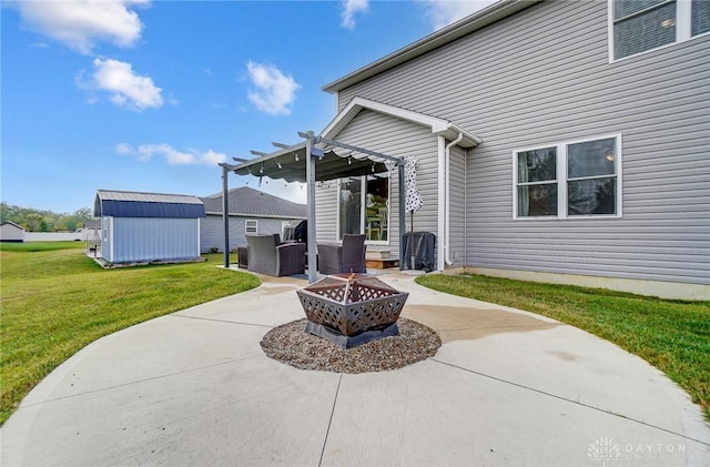 view of patio / terrace with a fire pit, a shed, and a pergola