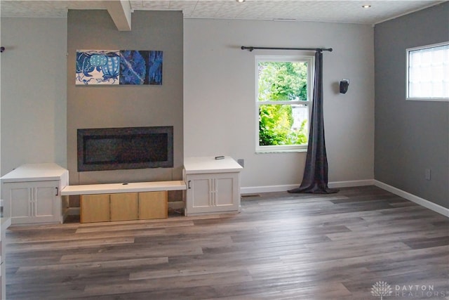 unfurnished living room with dark hardwood / wood-style flooring