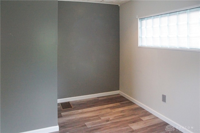 spare room featuring hardwood / wood-style flooring