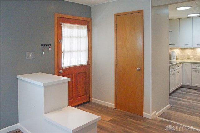 entryway with dark hardwood / wood-style floors