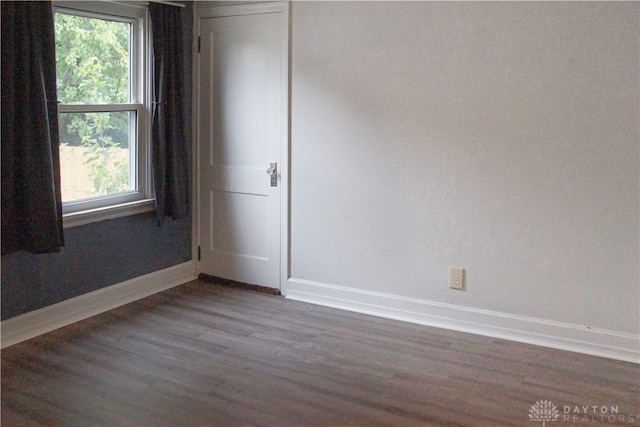 empty room featuring dark hardwood / wood-style floors