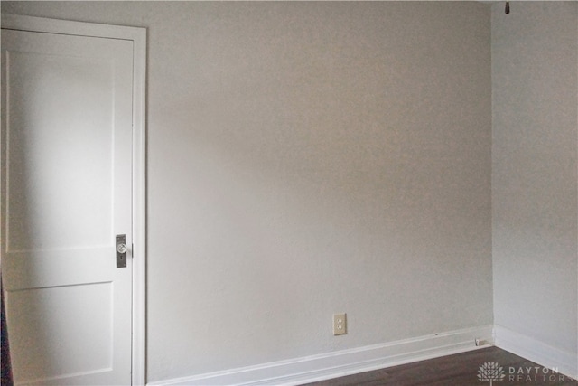 spare room featuring dark hardwood / wood-style flooring