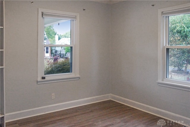 unfurnished room featuring dark hardwood / wood-style floors