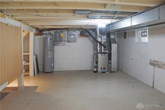 basement featuring electric panel, water heater, and heating unit