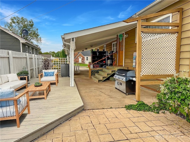 view of patio featuring an outdoor living space, grilling area, and a wooden deck