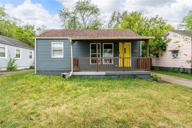 bungalow-style house featuring a front lawn and covered porch