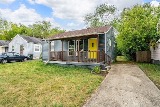 bungalow-style house with a front yard and a porch