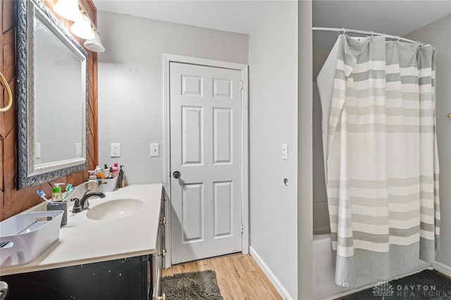 bathroom featuring hardwood / wood-style flooring and vanity