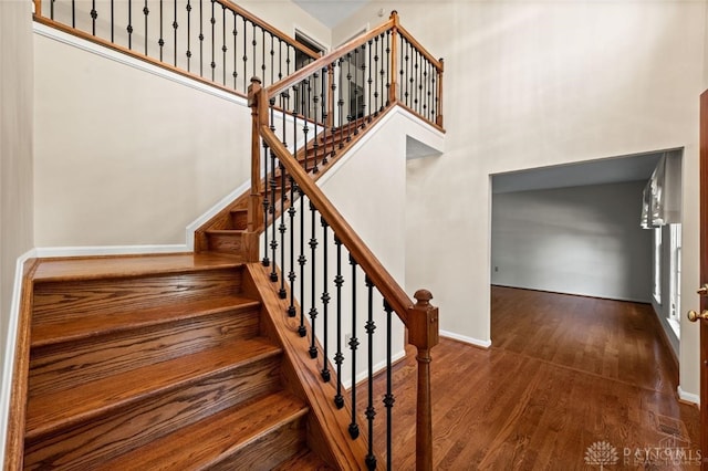 stairs with wood-type flooring