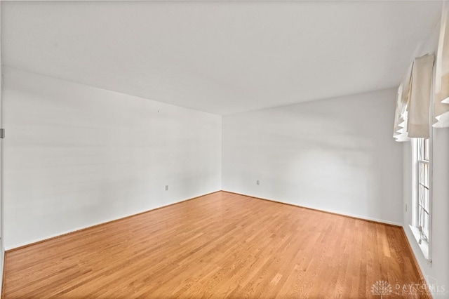 unfurnished room with light hardwood / wood-style flooring