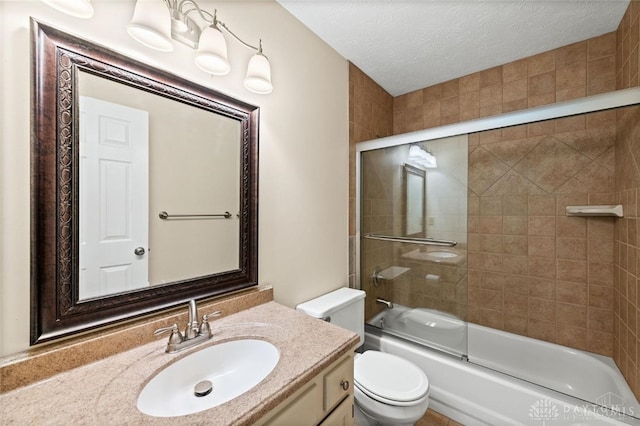 full bathroom with a textured ceiling, enclosed tub / shower combo, toilet, and vanity