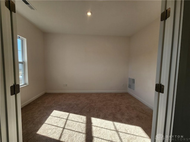 view of carpeted spare room