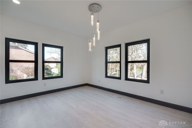 spare room with light wood-type flooring