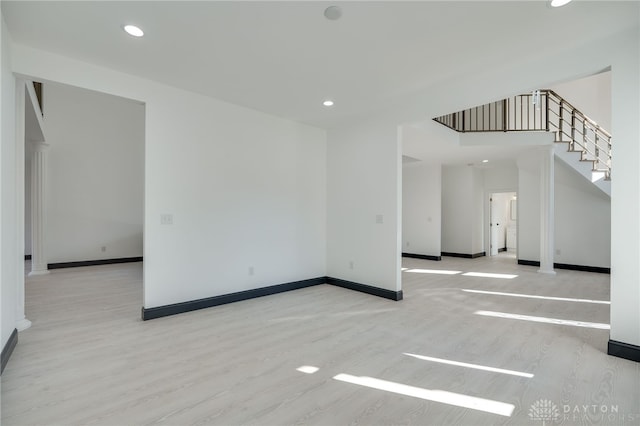 unfurnished room featuring light hardwood / wood-style floors