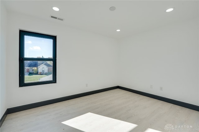 unfurnished room featuring light hardwood / wood-style flooring