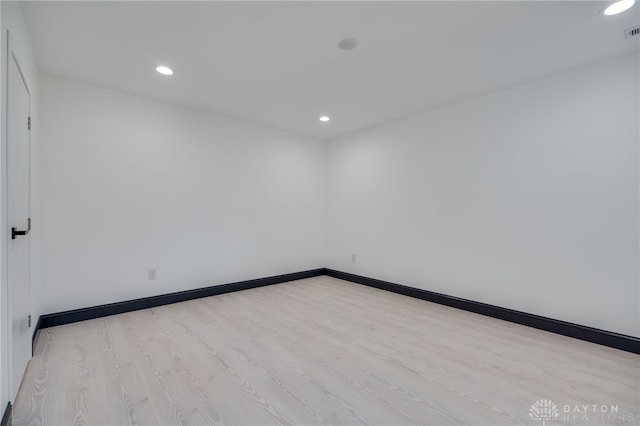 empty room with light hardwood / wood-style floors