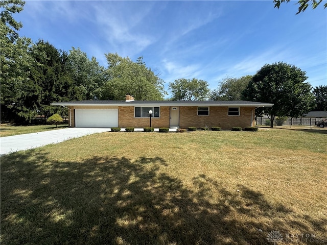 ranch-style house with a front lawn and a garage