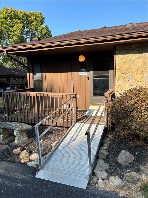 doorway to property featuring a deck