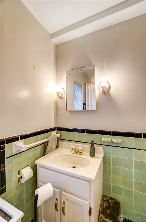 bathroom featuring tile walls and vanity