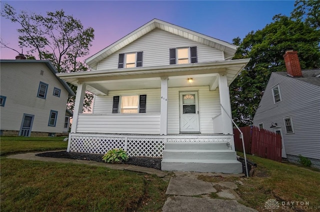 view of front of house with a yard