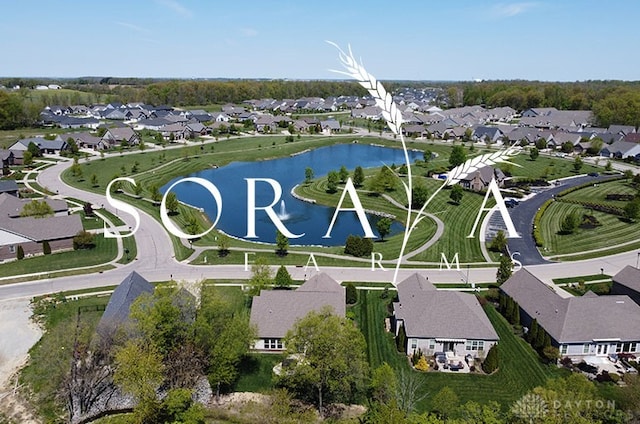 drone / aerial view featuring a residential view and a water view