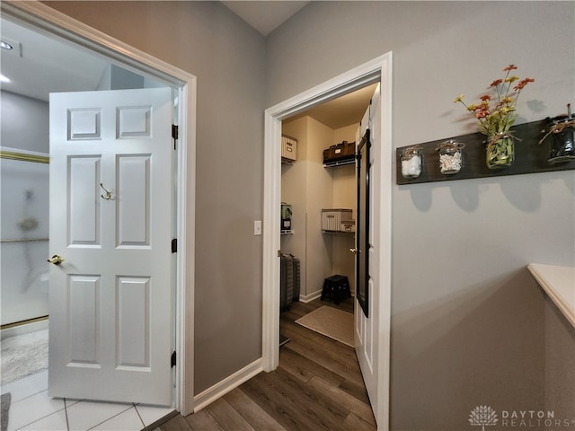 corridor featuring hardwood / wood-style flooring