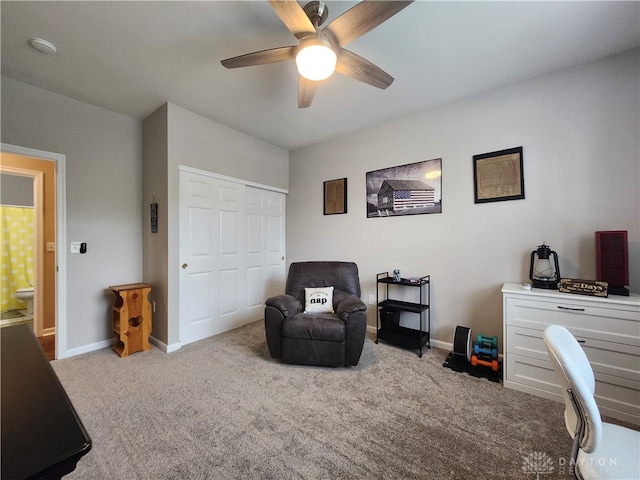 carpeted home office with ceiling fan