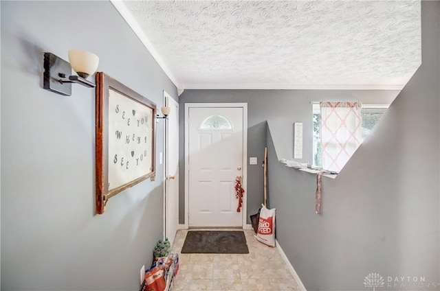 doorway to outside featuring a textured ceiling