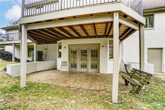 property entrance featuring a deck and a patio area