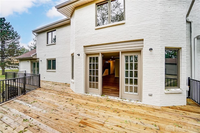 back of house with a wooden deck