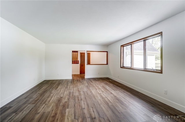 empty room with wood-type flooring