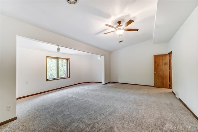 unfurnished room with ceiling fan and light colored carpet