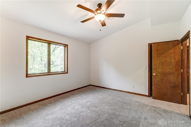 carpeted empty room featuring ceiling fan