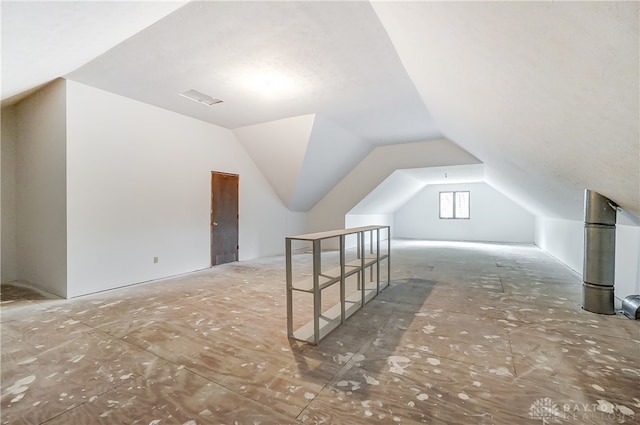 bonus room featuring vaulted ceiling