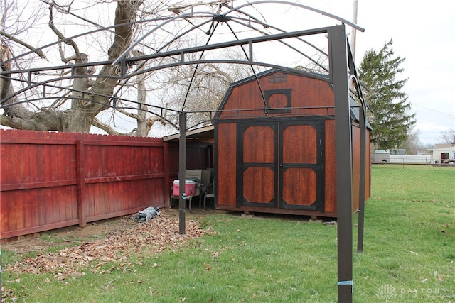 view of outdoor structure featuring a lawn