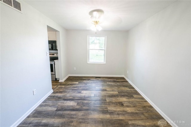 unfurnished dining area featuring dark hardwood / wood-style flooring