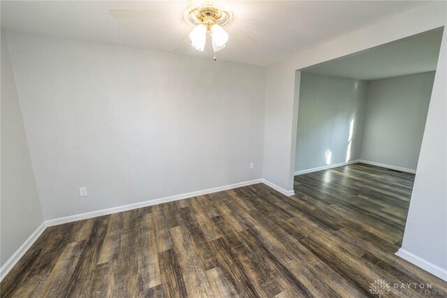 spare room featuring ceiling fan and dark hardwood / wood-style floors