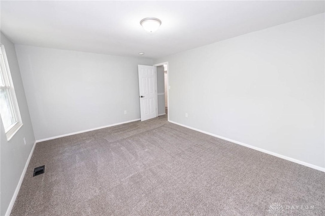 unfurnished room with carpet